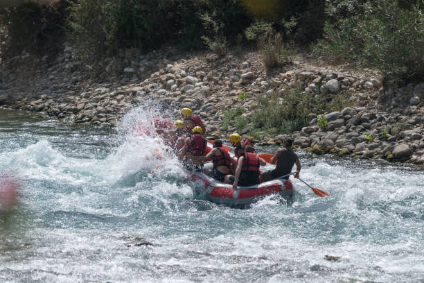 istock Group of people white water rafting 847053962