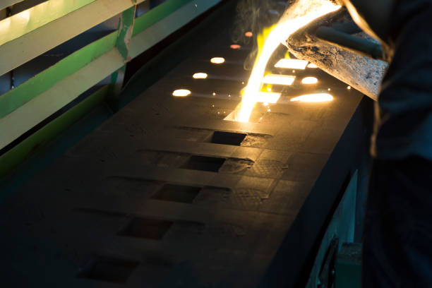 istock Iron molten metal is poured in sand mold 847054054