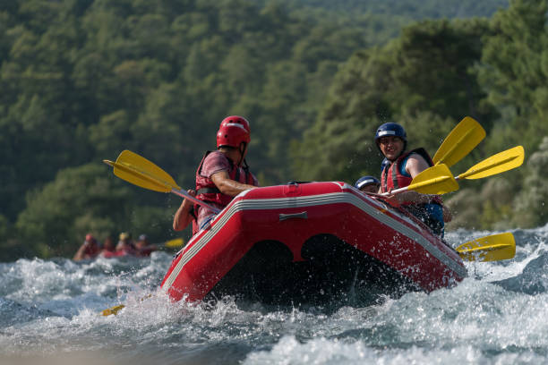 istock Group of people white water rafting 847055044