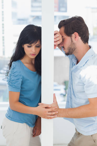 istock Couple are separated by white wall 847057986