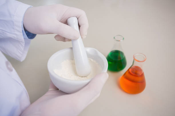 istock Scientist grinding powder with mortar 847062324