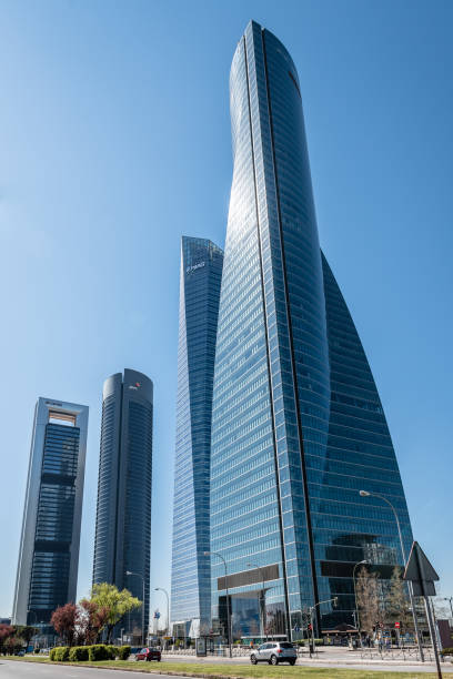 Madrid, Spain - June 25, 2017: Low angle view of skyscrapers in Cuatro Torres Business Area, CTBA (Four Towers Business Area) a business district in Madrid against blue sky