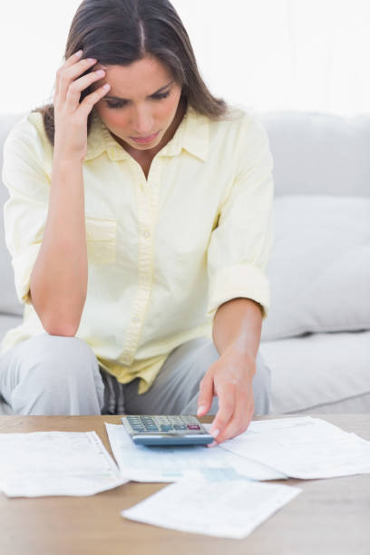 istock Stressed woman doing her accounts 847075816