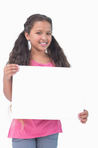 istock Little girl holding and presenting sign at camera 847076254