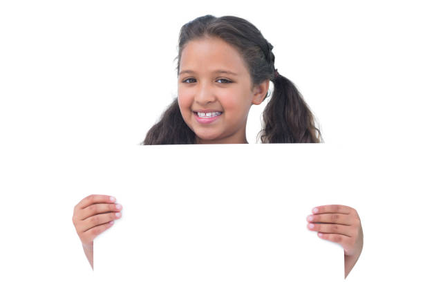 istock Smiling little girl holding and presenting sign at camera 847076264