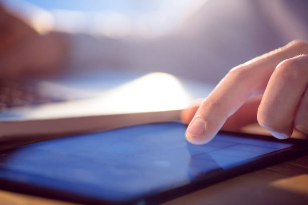 istock Businessman using laptop and tablet at desk 847076756