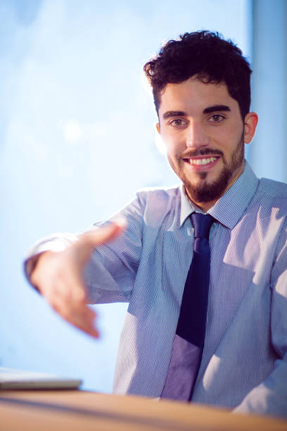 istock Businessman offering to shake hands 847076780