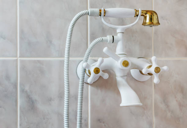 istock mixer white shower tile hanging on the wall 847079602