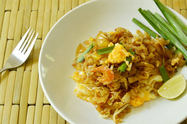 istock Pad Thai stir fried rice noodles with egg and yellow tofu 847085610