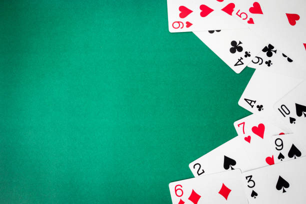 istock Playing cards on green background. Free space for text 847088262