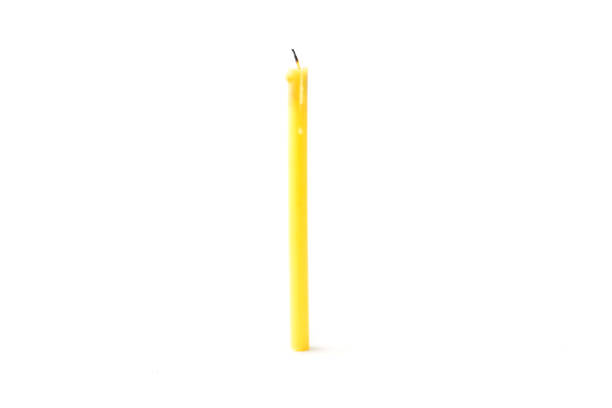 istock Tall yellow wax candle on a white background. 847088758