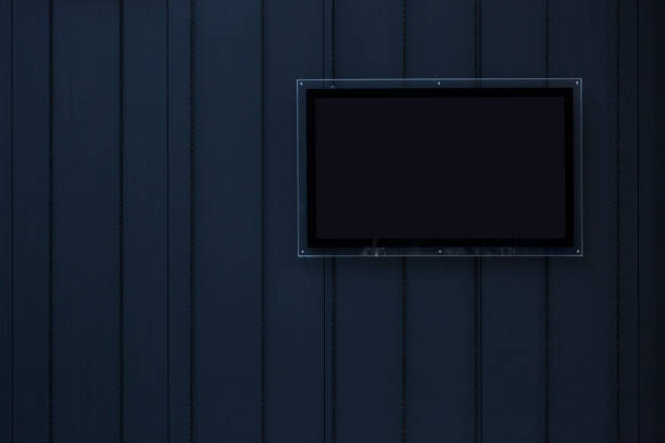 istock Composition of one black blank photo frames on blue wooden 847089776