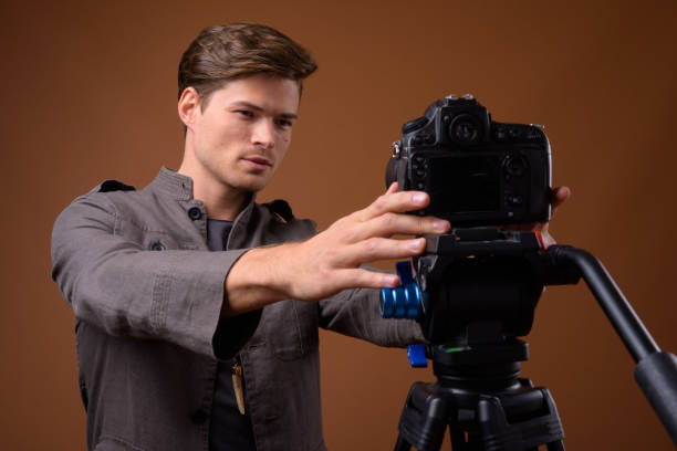 istock Studio shot of young handsome man getting ready for vlogging against colored background 847093630