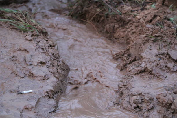 clay creek draining water from the road after heavy rains