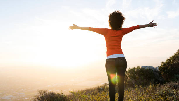 istock Woman standing with arms outstretched 847097210