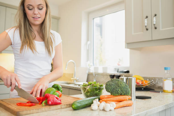 istock Woman cutting vegetables 847101848