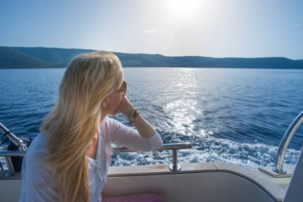 istock Woman on a luxury yacht 847104390