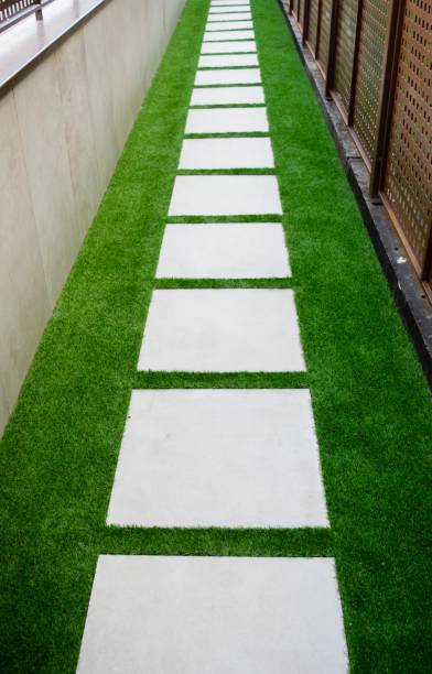 istock Pathway in garden, green lawns with bricks pathways 847104664