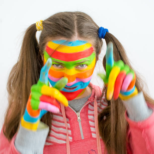istock Young woman with art makeup in rainbow colors 847104778