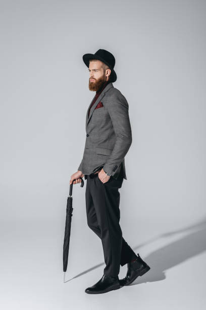 istock stylish man in hat with umbrella 847108030