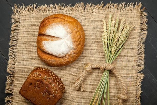 istock Homemade bread sourdough, rustic baked bread in wickerwork basket 847109176