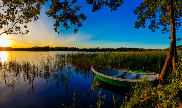 Boat by the lake at sunset