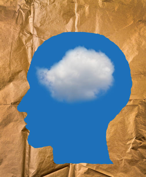 istock Crumpled paper shaped as a human head, blue sky and white cloud inside head. Positive and imagination concept. 847115838