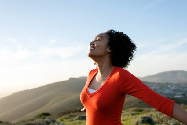 istock Woman standing with arms outstretched 847117684