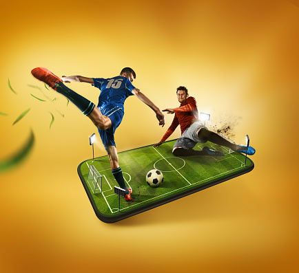 The football players in action on the phone, advertising and mobile football concept.