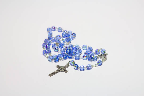 istock Rosary on a gray background. Christian cross. 847121686