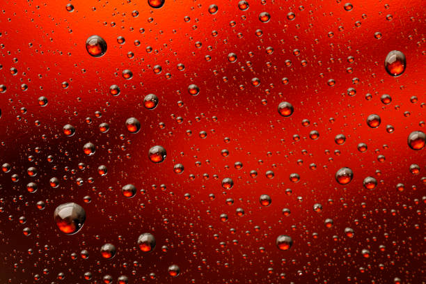 Ice cold glass fresh coca cola covered with water drops condensation  Cold drink Drops of water cola drink background Raindrops texture Close up Ice cold glass fresh beer covered with water drops condensation  Cold drink Drops of water Orange drink background Raindrops texture Close up red drink stock pictures, royalty-free photos & images