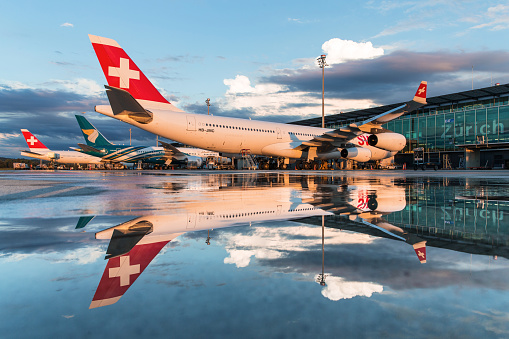 Zurich, Switzerland - August 5, 2017: Overview of Dock Midfield at Zurich International Airport. Various commercial airliners are parked at the gates.