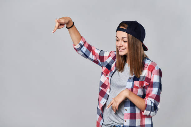 istock Teen girl pointing down at empty copy space 847136978