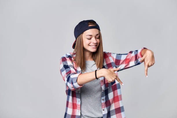 istock Teen girl pointing down at empty copy space 847137066