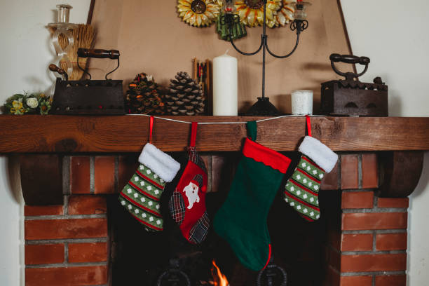 istock Family Hanging Socks on Christmas Fireplace 847144538