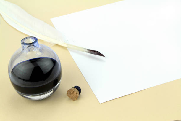 istock Quill pen in glass ink bottle 847147554