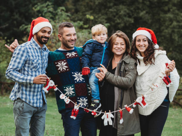istock Happy family decorating Christmas tree together 847156578
