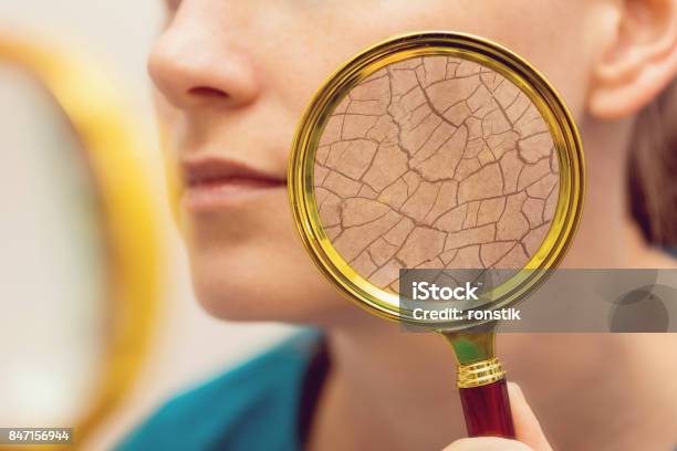 Aging And Dry Face Skin Concept Woman With Magnifying Glass Stock Photo - Download Image Now