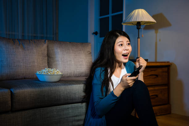 istock female student watching football championship 847159462