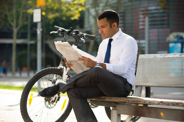 istock Concentrated Manager Reading Newspaper Outdoors 847161212