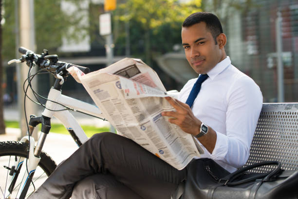 istock Handsome Hispanic Businessman with Paper in Park 847161270