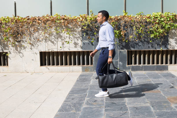 istock Hispanic Young Man with Leather Bag Running 847161490