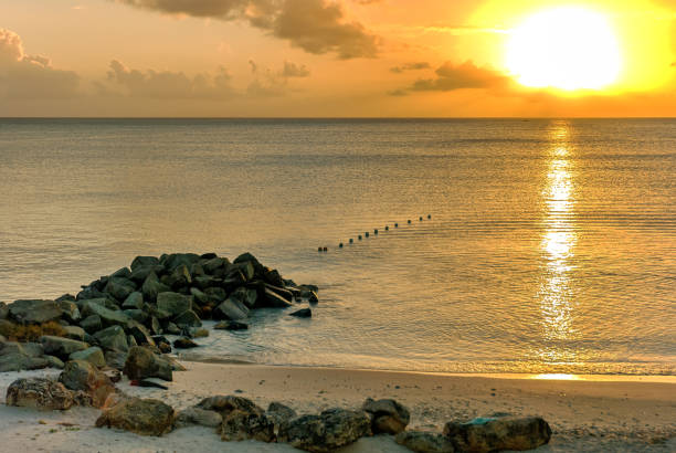 istock Beach golden sunset with reflections in the water 847165056