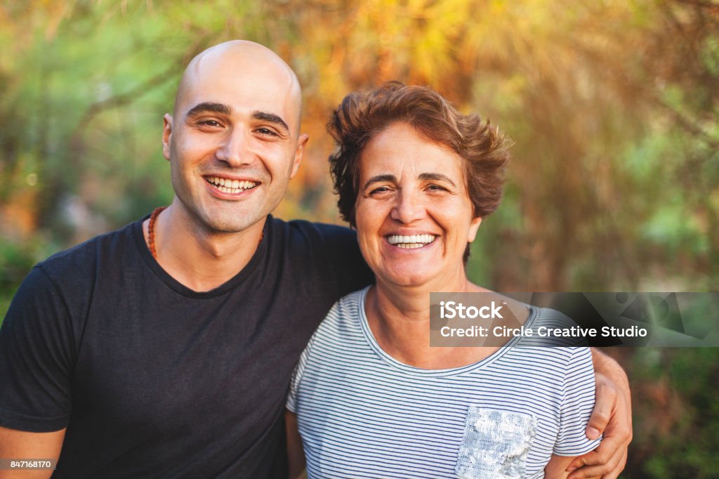 Loving mother and son Mature mother and young son smiling at the park Mother Stock Photo