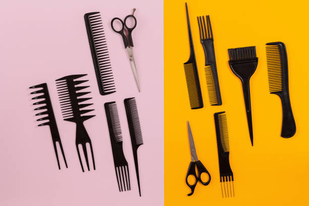 istock Hairdresser tools on pink and orange background with copy space 847172044