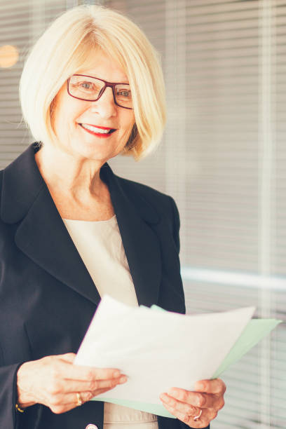 istock Positive Senior Business Lady Holding Documents 847172334