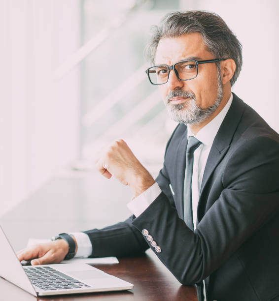 istock Intelligent handsome man with laptop in cafe 847172526