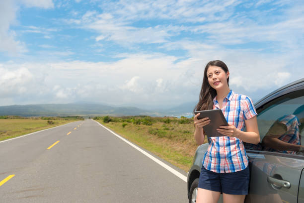 istock smiling beautiful female traveler holding pad 847183728