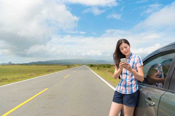 istock smiling female tourist using mobile smartphone 847183876