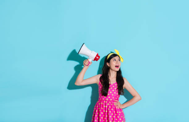 istock lady wearing cute dress looking at empty area 847188082